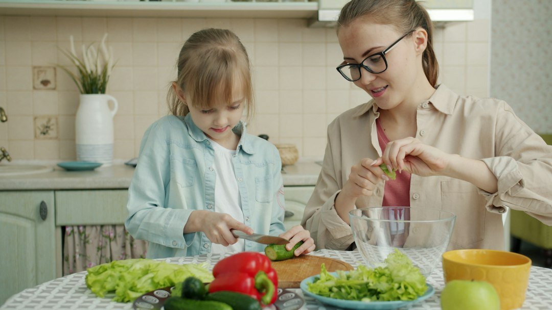 family preparing healthy meal in kitchen